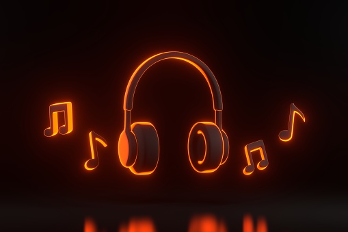 Headphones and melody note with bright glowing futuristic orange neon lights on black background. Concept of listening to music, radio, podcasts and books. 3D render illustration