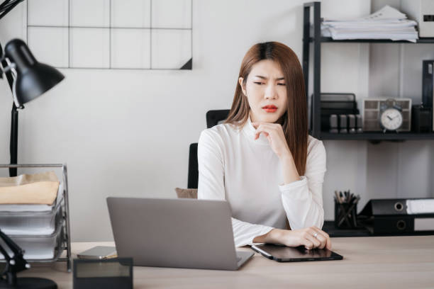 istock Stress businesswoman is sitting at table, under stress from working. 1816320071