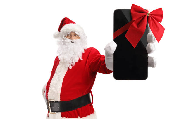 istock Santa claus holding a smartphone with a red ribbon bow 1816329209