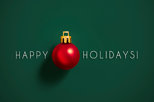 Christmas ornament with Happy holidays message on green background