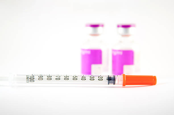 istock Disposable syringe and purple label injection vial 181634859