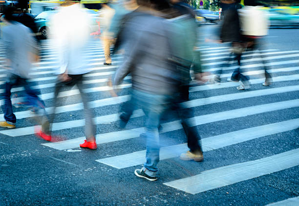 istock people crowd on zebra crossing street 181635368