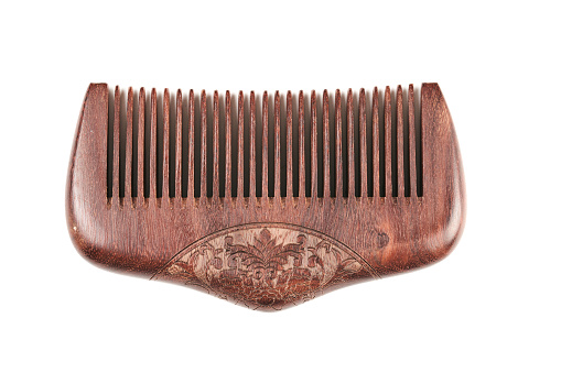 Brown wooden comb isolated on white background, eco-friendly hairbrush