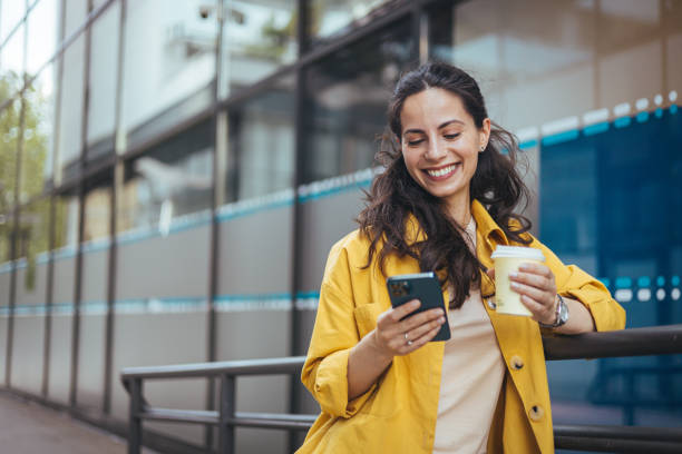 istock Girl using mobile phone on a city street. 1816362511