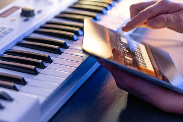 istock A man uses a tablet with an application for recording music. 1816370466