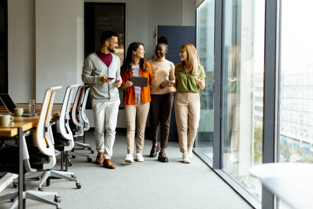 istock Young multiethnic startup team walking in the modern office 1816372102