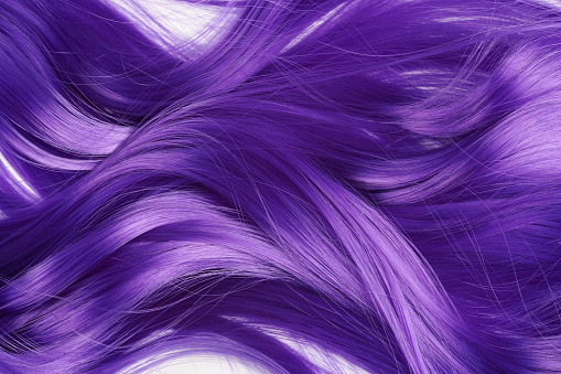 Natural looking shiny hair purple lilac bright color, cosplay wig on a white background