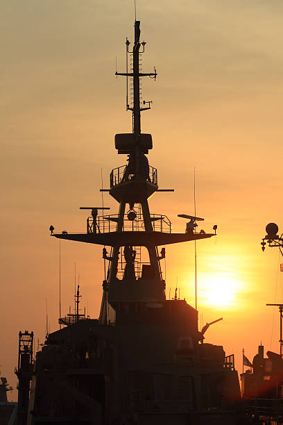 istock battleship with sunset behind 181638639