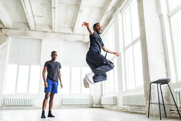 istock Two black men dancing together at dance lesson in exercise room 1816403575