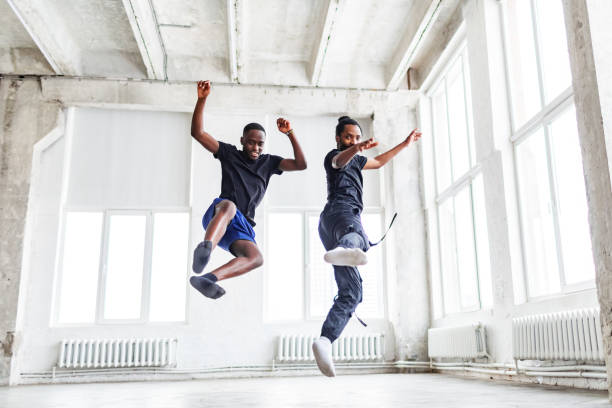 istock Two black men dancing together at dance lesson in exercise room 1816404967