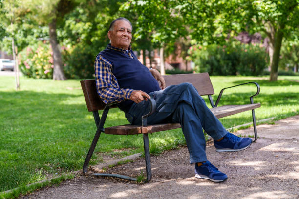 istock Elderly Man Enjoying a Peaceful Day at the Park on a Bench 1816416006