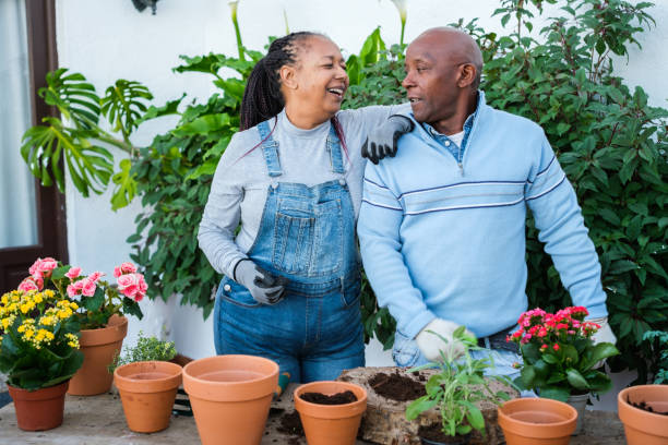 istock Couple doing gardening to share their secrets through networks online. Concept: Innovation, gardening, complicity 1816423018
