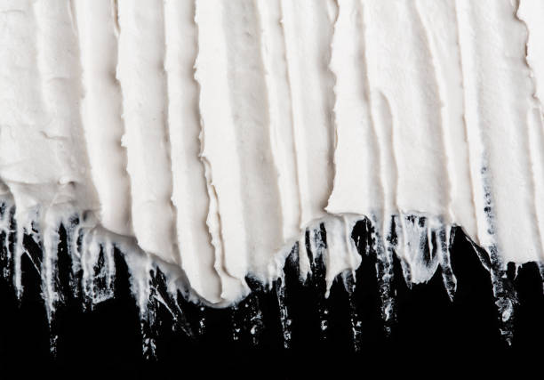 istock Structural plaster white on a black background. White Cream. paint smear. Plasticine 1816443133