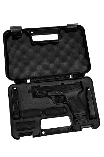 Modern semi-automatic pistol. A short-barreled weapon for self-defense. Arming the police, special units and the army. Weapon in a case for storage and transportation. Isolate on a white background.