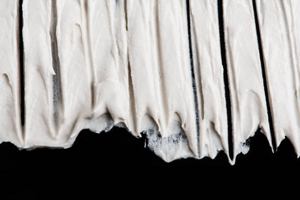 istock Structural plaster white on a black background. White Cream. paint smear. Plasticine 1816444151