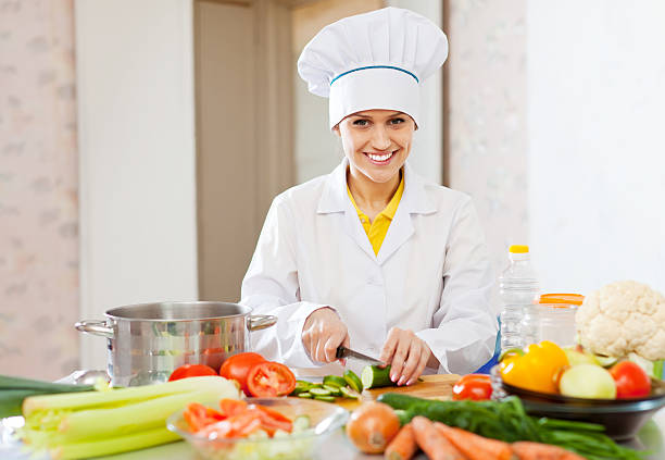 istock cook  in toque prepares veggie lunch 181644487