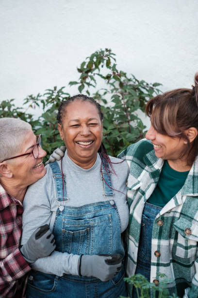 istock Three middle-aged women doing a botany course together and having fun. Concept: gardening, learning, plant care 1816449241