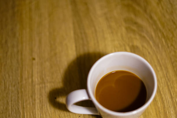 istock coffee in white cup on the wood table 1816458401