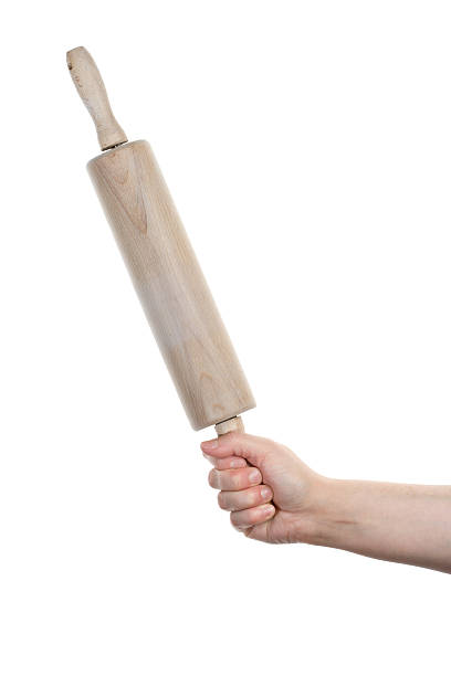 istock Female hand with wooden rolling pin 181647079