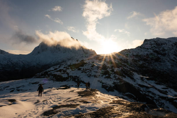 istock Sun shining over mountains as hiker climb in Norway 1816474436