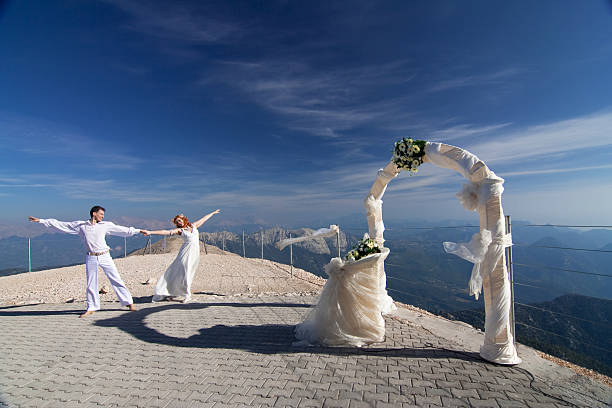 istock Newlyweds pose near the wedding arch 181647514