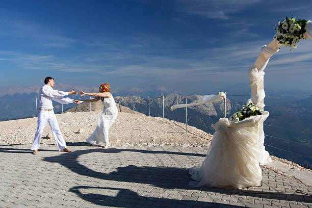 istock Newlyweds pose near the wedding arch 181647515
