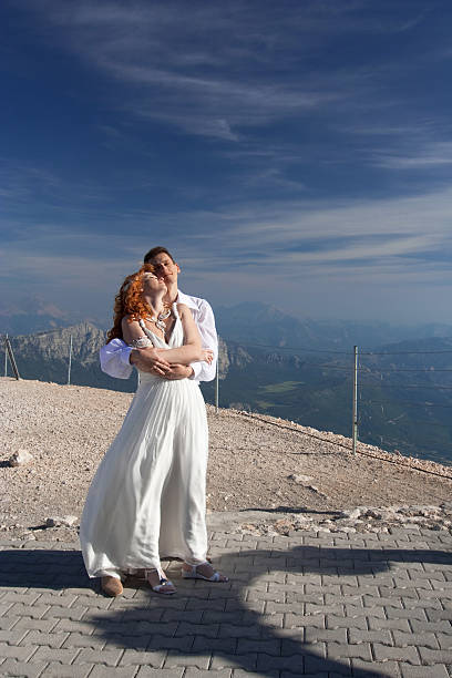 istock Newlyweds pose near the wedding arch 181647518