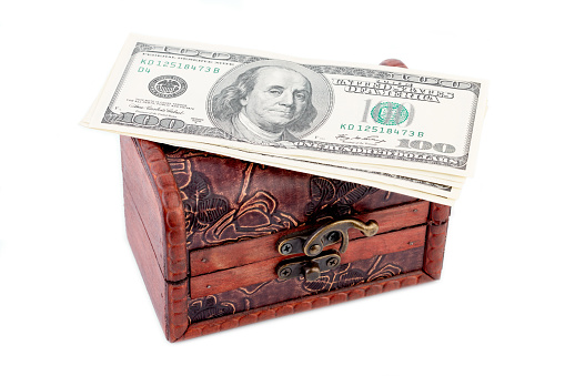 Treasure chest with many bank notes. Wooden chest. Treasure. Casket