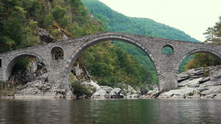 The Devil's Bridge in town Ardino /Bulgaria (Bulgarian: Dyavolski Most, Turkish: Seytan Koprusu) is an arch bridge over the Arda River in a narrow gorge. Massive Ottoman architectural masterpiece.