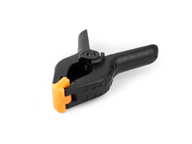 istock Spring clamp isolated on white background. Black plastic clamp. Set of small and big size. Clamping equipment for handicraft, joinery, photography, cars. 1816491409