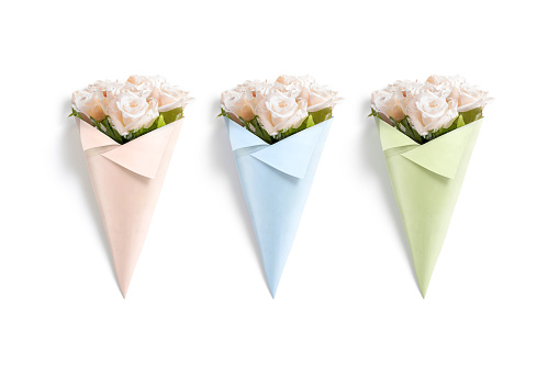 Blank craft colored flowers packaging cone mockup, top view, 3d rendering. Empty roses bunch wrapped in papery cones mock up, isolated. Clear blossom bouquet for valentine gift template.