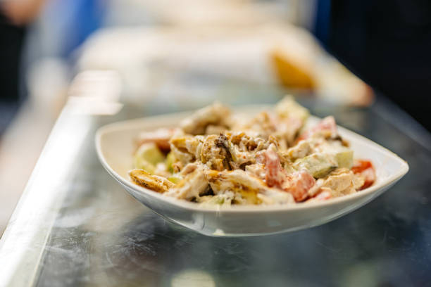 Chicken and vegetable salad in a bowl, ready for a meal.