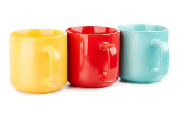 istock Colored cups for coffee and tea on a white background. Place for your text. 1816509501