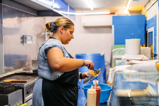 istock Female Food Service Worker Preparing Gyros At A Diner 1816510014