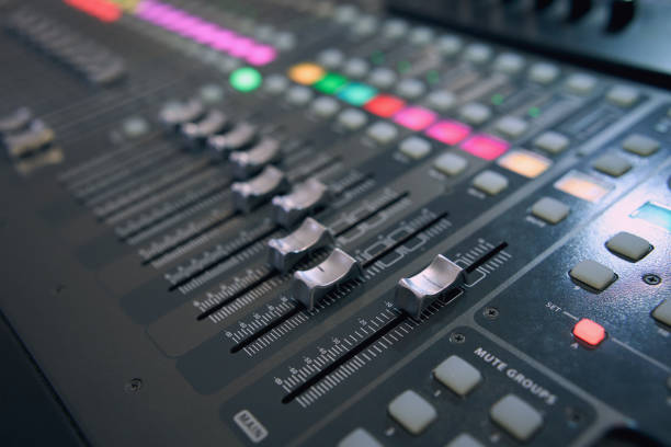 istock Professional audio mixing console. ​Mixer. Pro audio mixing board faders and knobs. Static shot of multi-track music recording equipment faders and sliders. 1816514051