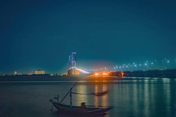 long exposure landscape of Suramadu bridge at night with romantic light