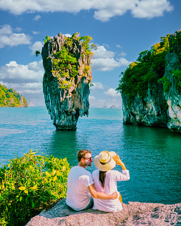 James Bond Island Phangnga Bay Thailand, couple visit the Island near Phuket Thailand, men and women on a boat trip at Phangnga Bay Thailand