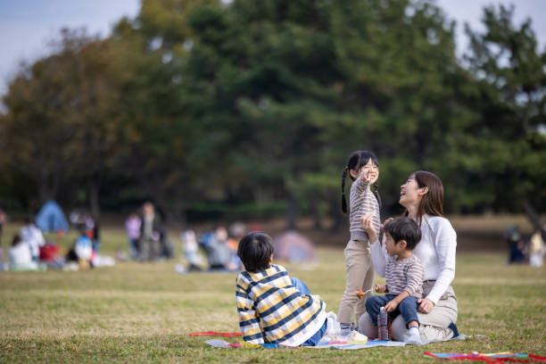 istock Family having lunch in public park 1816541571