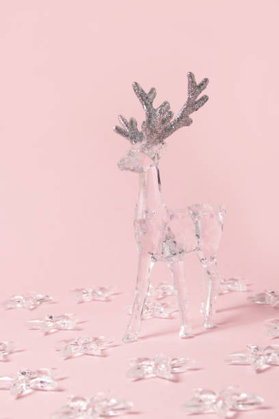 istock Transparent reindeer and stars on a pastel pink background 1816544244