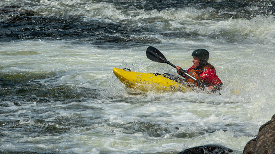 Canoeist in rough waters. Photo was made in south Norway (Otra River)