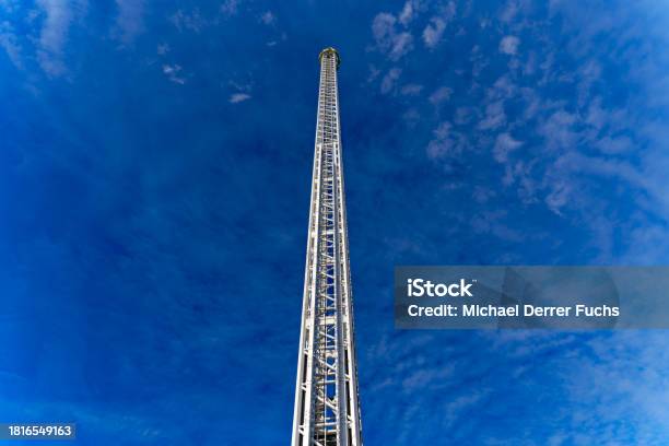 Scenic View Of Fair Ride Tower At Swiss Town With Blue Sky Background Stock Photo - Download Image Now