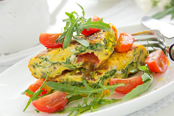 istock Omelet (Frittata) with tomatoes and herbs. 181654999