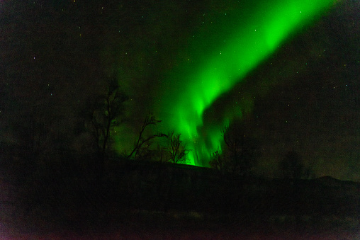 View of the aurora borealis, northern lights near Tromso city in the north of Norway.