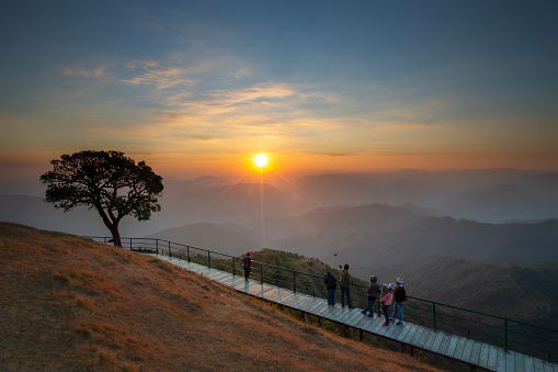 Tourist standing on beautiful corridor along the hill  at Doi Puico moutain view point at Mea Hong Son province,Thailand.