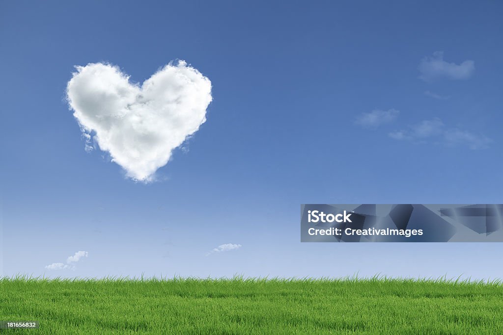 Love valentine day field Heart shape cloud floating in the air over green field Backgrounds Stock Photo