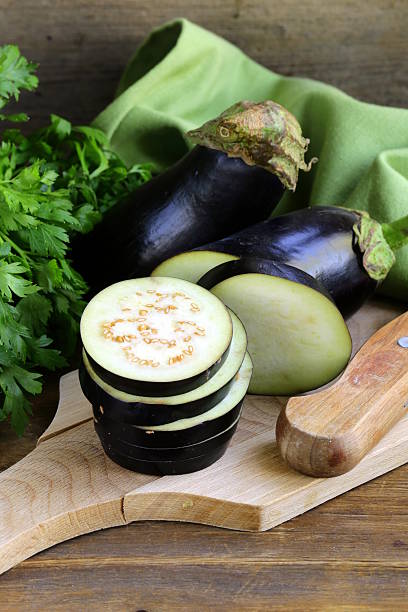 istock organic vegetables eggplant on a wooden chopping board 181657037