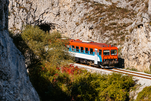 Train passing through the rocky mountains in Serbia.