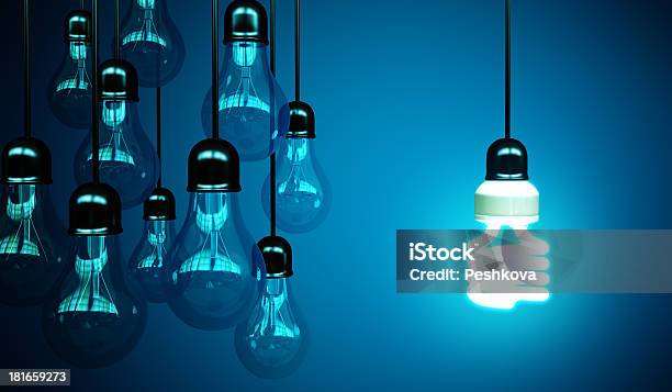 Lightbulbs On Blue Stock Photo - Download Image Now - Black Color, Bright, Creativity