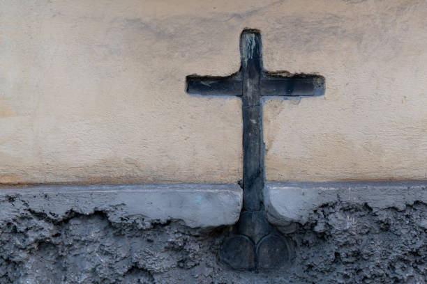 istock Wooden cross embedded in a stucco wall 1816612677