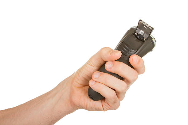 istock Hand holding an electric shaver 181661641